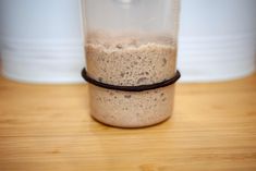 a blender is sitting on a wooden table