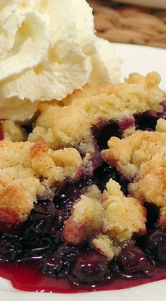 a piece of blueberry cobbler with ice cream on top