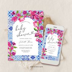 an image of baby shower with flowers on it and a cell phone next to it