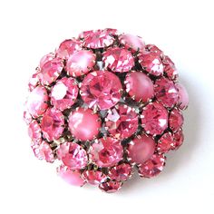 "Item: This is a pink rhinestone and cabochon brooch made in the 1950s by Warner. Founded by Joseph Warner this company was in business from 1953 and closed in 1971. The unique dome shape adds a dimensional aspect to the design a bit like a big pink bubble. The setting is a silver tone metal, the rhinestones are nice and bright and the brooch is in excellent condition. Be sure to check our other listings for lots more antique and vintage jewelry! Signature: Warner Measurements: 1 7/8\" diameter Pink Rhinestone Brooches For Formal Occasions, Vintage Pink Brooches For Party, Vintage Pink Brooch Pin, Cameo Pendant Necklace, Vintage Rhinestone Jewelry, Pink Bubbles, Pink Bling, Cameo Pendant, Rhinestone Jewelry