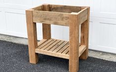 a wooden stool sitting in front of a garage door