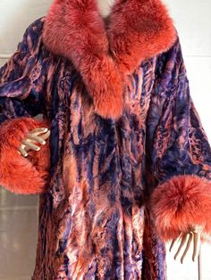 Beautiful, extravagant and unworn Karakul fur jacket in very eye-catching, rare colors. Size about 42. You can put up the collar and close it tighter at the neck with the appropriate fur hooks. So you can dress wonderfully depending on the cold and also protect yourself against rough temperatures. The fur trimmings on the sleeves can also be folded down accordingly, so that the grenadine-colored lush trimmings are beautifully visible. You can just as easily wear it folded down so that the violet Winter Formal Multicolor Outerwear, Elegant Pink Fur Coat For Fall, Formal Multicolor Winter Outerwear, Fitted Long-sleeved Fur Coat For Evenings, Fitted Long Sleeve Fur Coat For Evening, Elegant Multicolor Formal Outerwear, Evening Long Sleeve Fur Coat With Faux Fur Lining, Multicolor Evening Outerwear, Purple Long Sleeve Fur Coat With Faux Fur Trim