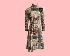 "Vintage Moschino Cheap and Chic patchwork print dress with every variety of animal print under the sun! High neckline, long sleeves and matching belt. Ideal for Autumn/Winter season and layering. Fastens with a zipper at the front, giving the dress a cool and casual feel. Quality Check  No notable stains or faults were found on the dress. The dress is in very good vintage condition.  Measurements (Approximate) 34\" Chest  28\" Waist 35.5\" Hips  14.75 Sleeve Length (Underarm) 10\" Cuff  41\" Length (Centre Back neckline to Hem of Skirt)" Dress Animal Print, Vintage Moschino, Moschino Dress, Moschino Cheap And Chic, Patchwork Print, Safari Style, High Neckline, Dress Clothes For Women, Summer Wear