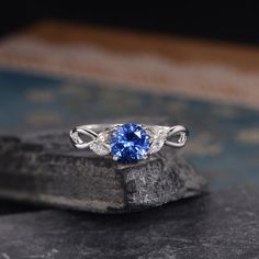 Lab Sapphire Engagement ring White Gold September Birthstone Marquise Moissanite Leaf Floral Flower Split Shank Bridal Anniversary WomenSimilar Design:https://www.etsy.com/listing/527392974https://www.etsy.com/listing/541192467https://www.etsy.com/listing/527395084ITEM INFORMATIONMetal Type – Solid 14k Rose GoldBand Width – (approx. 1.25mm)Center Stone – 7mm Lab Sapphire, Round CutSide Stone – MoissaniteWeight – 0.25ctShaped – Marquise Cut**Stone Replacement**Available with any other gemstones, Engagement Rings With Blue, Sapphire Engagement Ring White Gold, Woman Rings, Cute Promise Rings, Ring Upgrade, Trinity Ring, Elephant Ring, Band Ideas, Ladies Silver Rings