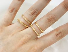 Make 'em admire your bling with this 4-stackable, Sterling Silver & Gold-plated Ring Set! Available from size 5-10. Featuring 4 different-style bands, this shimmery jewelry will have you winning the day with a ridiculously glam look. Show off your flashy style with these trendy rings!  FAQ: How many rings are included in the set?  -This set includes 4 rings.  Can the rings be worn individually or only as a set? -You can wear these rings together or separate. Are the rings made of real sterling silver and gold-plated? -These rings are 925 Sterling Silver and the gold set is 14k gold plating over sterling silver. Minimalist Stackable Rings With Diamond Cut Open Band, Minimalist Diamond Cut Open Band Stackable Rings, Minimalist Adjustable Ring With Diamond Cut, Minimalist Adjustable Diamond Cut Rings, Fine Jewelry 14k Gold Toe Stackable Rings, Fine Jewelry 14k Gold Stackable Toe Rings, 14k Gold Fine Jewelry Stackable Toe Rings, Adjustable Minimalist Stackable Rings With Diamond Cut, Adjustable Minimalist Diamond Cut Ring