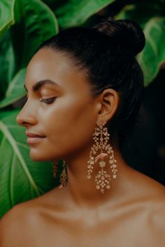 A bird perches within a delicate bower of blooming vines and blossoms. Rich with movement, this shimmering arrangement sways like garden foliage in the summer breeze. Brass with sterling silver posts. Nickel and lead free.4.75” [12 cm] long. Product Placement Photography, Blooming Vines, Stylish Jewelry Accessories, Dressy Earrings, Long Statement Earrings, Run The Jewels, Style Savvy, Nature Inspired Design, Black Jewelry