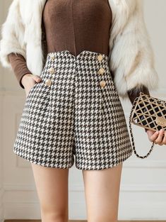 Slim fit shimmery tweed shorts with a high waisted fit, roomy legs, side pockets, golden button decorations and houndstooth plaid pattern all over. Concealed back zipper. S: 24" waist, 34" hips, 13" rise, 25" thighs, 2.5" inseamM: 25.5" waist, 35.5" hips, 13" rise, 25.5" thighs, 2.5" inseamL: 27" waist, 37" hips, 13" rise, 26" thighs, 2.5" inseamXL: 28.5" waist, 38.5" hips, 13" rise, 26.5" thighs, 2.5" inseam Fall Tweed Bottoms With Pockets, Short Tweed Bottoms For Work, Plaid Tweed Bottoms For Fall, Plaid Short Bottoms For Fall, Casual Tweed Shorts, Tweed Shorts, Button Decorations, Overall Dress, Sweater Blouse