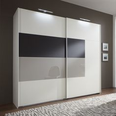 a white and black cabinet in a living room