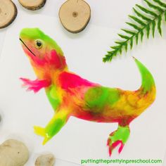 an image of a colorful lizard painted on paper