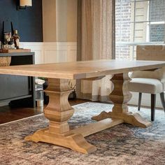 a wooden table sitting on top of a rug