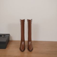 Looking for a stylish and sophisticated boot that will take your look to the next level? Then check out our Brown Block Heel Knee High Boots! These amazing boots are made from premium leather and feature a sleek pointed toe design. They're perfect for dressing up or down. and they'll add a touch of elegance to any outfit. Plus. the comfortable block heel makes them ideal for walking and standing all day. Upper: Leather/Suede Lining: Leather Outsole: TPR Toe: Pointed Toe Closure: Zip Heel: 5cm/2' Brown Faux Leather Martin Boots For Work, Trendy Fall Office Mid-calf Boots, Brown Pointed Toe Mid-calf Boots For Fall, Fall Brown Pointed Toe Mid-calf Boots, High Ankle Heeled Boots For Office In Fall, High Ankle Heeled Boots For Office And Fall, Office Fall High Ankle Heeled Boots, Faux Leather Martin Boots For Fall Workwear, Fall Workwear Martin Boots In Faux Leather