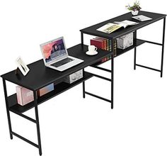 two computer desks sitting next to each other with books on them and a laptop