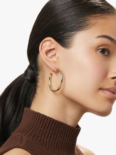 You can never go wrong with this pair of gold hoop earrings with a high-polish texture and hypoallergenic titanium posts. Carefully crafted and dipped in 14k gold, these classic gold hoops are meant to be worn every single day by a confident and chic woman. Score bonus styling points by pairing these gold hoop earrings with a thin gold collar. • Versatile & timeless gold hoops• Coated with a thick 14k gold layer & feature hypoallergenic titanium posts • Comfortable to wear all day long 14k Gold Hoop Earrings, Round Earring, Tiered Necklace, Gold Collar, Classic Gold, Letter Necklace, Silver Pieces, Gold Hoops, Round Earrings