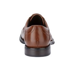 Bring true sophistication and class to your look with these cap toe oxfords. The versatile, yet traditional style of the polished synthetic uppers paired with handcrafted, vintage details and brogue accents create a look that is as sleek as it is timeless. These men’s dress shoes have a cushioned, latex footbed combined with flexible construction, giving your feet long-lasting comfort and support. They are a timeless classic, crafted with care to elevate any dress look. Casual Oxford Shoes, Shoe Warehouse, Oxford Shoe, Vintage Details, Closed Toe Shoes, Oxford Dress Shoes, Cap Dress, Rubber Shoes, Round Toe Heels