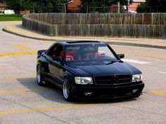 a black car parked in a parking lot