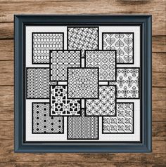 a cross stitch pattern in black and white on a wooden background with the words,