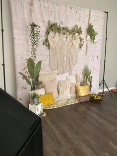 a living room with white brick wall and wood flooring, plants on the wall