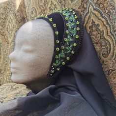 Ready made French Hood made from Velvet in black with a beautiful sheen, decorated with black lace, ribbon in black with a tendril motive in shades of green, acrylic vile green facetted pearls with tiny white pearls and black pearls on the ribbon, all pearls are sewn on and not glued.  The Hood has a sewn in circlet and ties for you to make sure it stays on your head.  The base of this hood is an acrylic foil which stays in shape, even in rain.  Comes with a black chiffon veil which is attached Handmade Black Gothic Costume Hats And Headpieces, Elegant Black Beaded Hat, Elegant Black Headband As A Gift, Elegant Black Headband As Gift, Traditional Black Hat As Gift, Handmade Black Festival Headpieces, Elegant Black Festival Headpieces, Handmade Black Headband, Elegant Handmade Black Headpiece