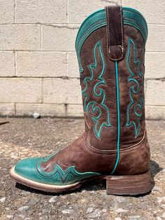 Get boots that show your style spunk with these Roper Women's Shyla Burnish Blue Wing Tip Square Toe Cowgirl Boots! These on-trend cowgirl boots feature a square toe design and beautiful blue burnish finish that'll make you the star of the show. Step out in style! Square Toe Vintage Brown Leather Vamp & Shaft Burnish Blue Wing Tip & Crown Double Welt 11" Shaft 14" Circumference All Leather Lining 1 3/8" Leather Walking Heel Leather Sole REST Removable Insole ¾ Welt Sole With Nails & Lemonwood Pe Western Style Square Toe Boots For Western-themed Events, Fitted Square Toe Heeled Boots For Rodeo, Square Toe Heeled Boots For Western-themed Fall Events, Western Wide Calf Heeled Boots With Square Toe, Square Toe Boots For Ranch In Fall, Country Style Fitted Boots With Square Toe, Country Style Fitted Square Toe Boots, Western Turquoise Boots For Fall, Western Heeled Boots With Square Toe