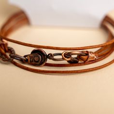 Approx. 14" Handmade in Laurel, Mississippi Beautifully colored natural brown leather with Novi's signature clasp allowing it to snap together with other NoVi bracelets for an original look. Wraps around the wrist twice, or can be worn as a choker. For a looser fit, add an extender! Everyday Brown Jewelry With Waxed Finish, Brown Leather Wrap Bracelet As Gift, Brown Leather Wrap Bracelet Gift, Brown Leather Wrap Bracelet For Gift, Handmade Adjustable Leather Wrap Bracelet, Everyday Brown Leather Strap Jewelry, Brown Jewelry With Waxed Finish As Gift, Brown Waxed Finish Jewelry As Gift, Brown Leather Strap Wrap Bracelet Gift