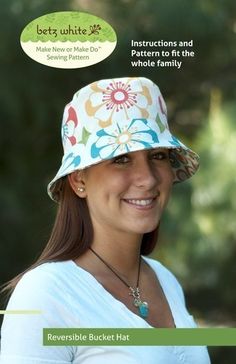 a woman wearing a white hat with colorful flowers on it and the words women's day written in front of her