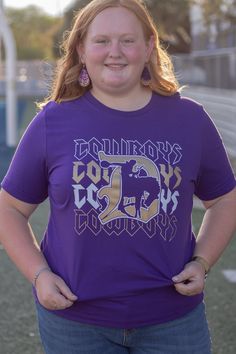 These Cowboy game day tees definitely have a rock n roll vibe on repeat! Show your spirit in this navy unisex tee. This tee typically ships within 1 to 2 days. Shop Great Gifts at MainStreet Mercantile. Purple Graphic Print T-shirt For Team Spirit, Purple Letter Print Top For Sports Fans, Purple Tops With Letter Print For Fan Gear, Purple Letter Print Tops For Fan Gear, Graphic Tee T-shirt For Game Day With Text Print, Game Day Graphic Tee With Text Print, Graphic Tee With Text Print For Game Day, Purple Graphic Print Fan Apparel T-shirt, Casual Purple T-shirt For Fan Gear