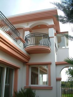 an apartment building with balconies and wrought iron railings