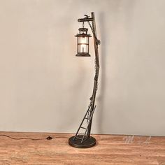 a lamp that is sitting on top of a wooden table next to a light bulb