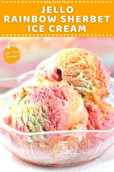 two scoops of jello rainbow sherbet ice cream in a glass bowl