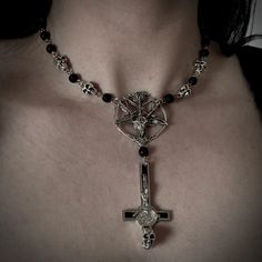 This gothic choker is perfect for those that love expressing their dark side. This choker has many different elements of symbolism. It includes a pentagram with the famous symbolic baphomet. Attached to it is an inverted cross with a skull at the bottom. The chain is made of metal links and lava stones. Inverted Cross, Different Elements, Gothic Choker, Love Express, Gothic Chokers, Goth Jewelry, A Skull, Lava Stone, Dark Side