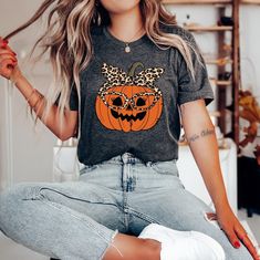 TigerCoDesigns Leopard Pumpkin Shirt, Fall Pumpkin Shirt, Pumpkin Lover Shirt, Funny Halloween, Halloween Shirt, Thanksgiving Shirt, Autumn TShirt This customized gift can be used by all the members of family, it will be the best wanderlust, travel apparel unisex personalized shirt ever! 👉 Product Details:The T-Shirts, Hoodies, Youth, Toddler and Baby Suits(onesie) are unisex.👈 👉Reading the Sizing Chart: Please note that the sizing chart includes the measurements of one side of the shirt, not Spooky Short Sleeve Shirt For Fall, Spooky Short-sleeve Fall Shirt, Casual Short Sleeve Tops For Costume Party, Casual Halloween Shirt For Costume Party, Casual Halloween Costume Party Shirt, Fall Crew Neck T-shirt For Costume Party, Cute Orange Tops For Halloween, Cute Orange Top For Halloween, Horror Themed Short Sleeve T-shirt For Fall