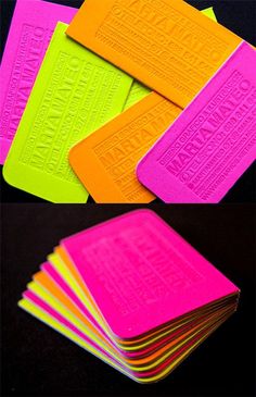 neon colored sticky notes are stacked on top of each other, with the words written in bright