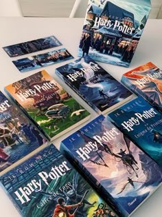 harry potter books laid out on a table with the book covers folded down in front of them