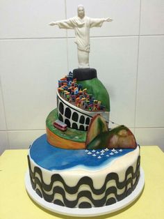 a cake with a statue on top of it