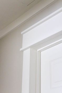 the corner of a room with white paint