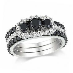 Bold and mysterious, elegant and dazzling - this bridal set is everything she's looking for. Fashioned in 10K white gold, the engagement ring features three alluring enhanced black diamonds, each framed with shimmering white diamonds and arranged in perfect symmetry across the white diamond-lined shank. To seal your vows, two enhanced black diamond-lined wedding bands fit on either side of the engagement ring, completing this unique design. Radiant with 2 cts. t.w. of diamonds and a bright polis Black Diamond Infinity Ring, Black Diamond Bridal Set, Black Diamond Solitaire Ring, Perfect Symmetry, Infinity Rings, White Diamond Rings Engagement, Diamond Bridal Ring Sets, Black Diamond Engagement, Diamond Wedding Rings Sets