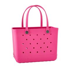 a pink bag with holes on the side and handles is sitting in front of a white background