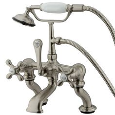 an old fashioned faucet with two handset and hoses attached to it