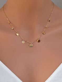 14k gold filled or 925 sterling silver or rose gold delicate coin disc necklace Perfect looking on its own or layering with other dainty necklaces. It makes of.. -9,7,6, and 3.8mm Sterling Silver or 14k gold fill disc attach -Sterling Silver or 14k gold fill cable chain with spring claw. -Come up with beautiful ribbon gift box that enhance your present ... It could be 925 Sterling Silver or 14k Gold Fill GOLD COINS https://www.etsy.com/listing/258733697/gold-coin-necklace-sterling-silver-coin?re Coin Choker, Gold Coin Necklace, Chain Extenders, Disc Necklace, Coin Necklace, Silver Coins, Drop Necklace, Dainty Necklace, Gold Filled Jewelry