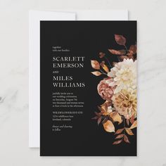 an elegant wedding card with flowers and leaves on the front, in dark grey tones