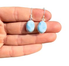 This listing is for a single (1) pair of beautiful Oval Larimar Earrings in Sterling Silver.  This is an individual listing, so you will be purchasing the exact pair of Earrings in the photos above and described below. Please let us know if you have any questions about the item after reviewing the photos and details below! Crystals & Stones: Larimar (Also Known as: Dolphin Stone, Atlantis Stone) Crystal Origin: Dominican Republic Type: Dangle Setting: Bezel Shape: Oval Surface: Polished Cut: Cab Larimar Earrings, Crystals Stones, Oval Earrings, Oval Earring, Stone Crystal, Earrings Sterling Silver, Dominican Republic, Sterling Earrings, Semi Precious Gemstones