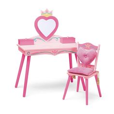 This vanity set is fit for the fairest of them all. The vanity has a heart-shaped mirror with two heart-topped boxes for storing jewelry, make-up and other treasures. The matching ''throne'' has a crown backrest with a heart-shaped back cushion and a regal padded seat cushion with gold tassels. Your princess will enjoy preparing for any royal appearance with her vanity set. Color: Pink. Girls Vanity Table, Princess Vanity, Kids Vanity Set, Girls Furniture, Girls Vanity, Nursery Furniture Collections, The Fairest Of Them All, Storing Jewelry, Kids Activity Table