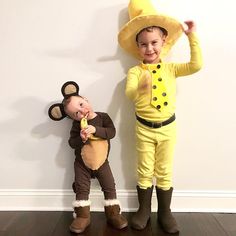 two children dressed in costumes standing next to each other