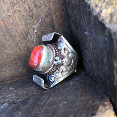 Large beautiful red coral set on sterling silver Tibetan saddle ringThe ring is nick-named "saddle" because it resembles a yak saddle which is high on both ends. The ring is nick-named "saddle" because it resembles a yak saddle which is high on both ends.Coral dimensions H 14mm x 12mmRings height approximately 32mmThis is an open back ring which can fit sizes 8 to11rings Traditional Red Ruby Ring, Traditional Red Ceremonial Rings, Traditional Red Ring Stamped 925, Saddle Ring, The Ring, Red Coral, Earring Necklace, Ring Necklace, Saddle