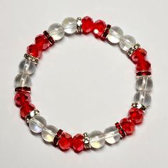 Crystal Beaded Stretch Bracelet Handmade By Me Red Faceted Crystal Beads Clear Iridescent Glass Beads Red Rhinestone Accents 7.5 Length New Elegant Red Crystal Bracelet With 8mm Beads, Red Beaded Bracelets With Spacer Beads For Party, Red Crystal Bracelet With Spacer Beads, Red Adjustable Stretch Bracelet With Polished Beads, Red Beaded Bracelets With Round Beads For Holiday, Red Beaded Bracelets For Holidays, Red Beaded Stretch Bracelet For Christmas, Holiday Red Beaded Bracelets With Round Beads, Elegant Red Beaded Stretch Bracelet