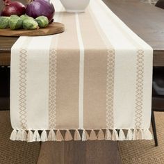 an image of a table setting with onions and cabbages on the table cloth,