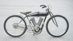 an old fashioned bicycle is parked on the sidewalk