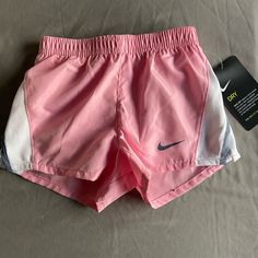 Light Pink With White And Grey. Nwt! Size 2t. Sporty Shorts For Summer Playtime, Nike Summer Shorts For Playwear, Nike Shorts For Summer Playwear, Sporty Spring Bottoms For Playtime, Sporty Spring Playtime Bottoms, Nike Sporty Shorts For Playwear, Sporty Nike Shorts For Playwear, Sporty Summer Bottoms For Playtime, Pink Playtime Shorts