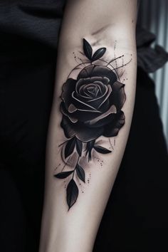 a black rose tattoo on the arm