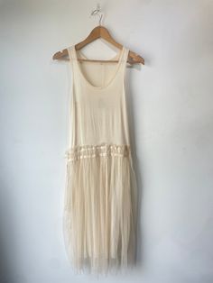 Vintage Drop Waist Ballerina Dress. Super soft and stretchy on top with pleated tulle over a shiny layer on bottom. Two ties on the side can be left open or tied into a bow. The whole dress is a bit sheer making it super sexy. Approximate measurements:Underarm to underarm: 15" Length: 44" Pleated Tulle Summer Dress, Summer Pleated Tulle Dress, Spring Mesh Dress With Sheer Back, Sheer Sleeveless Tulle Maxi Dress, Spring Sheer Tulle Maxi Dress, Spring Mesh Dress With Sheer Back And Stretch, Sleeveless Tulle Maxi Dress For Summer, Chic Tulle Midi Dress For Summer, Summer Stretch Dresses With Tulle Skirt